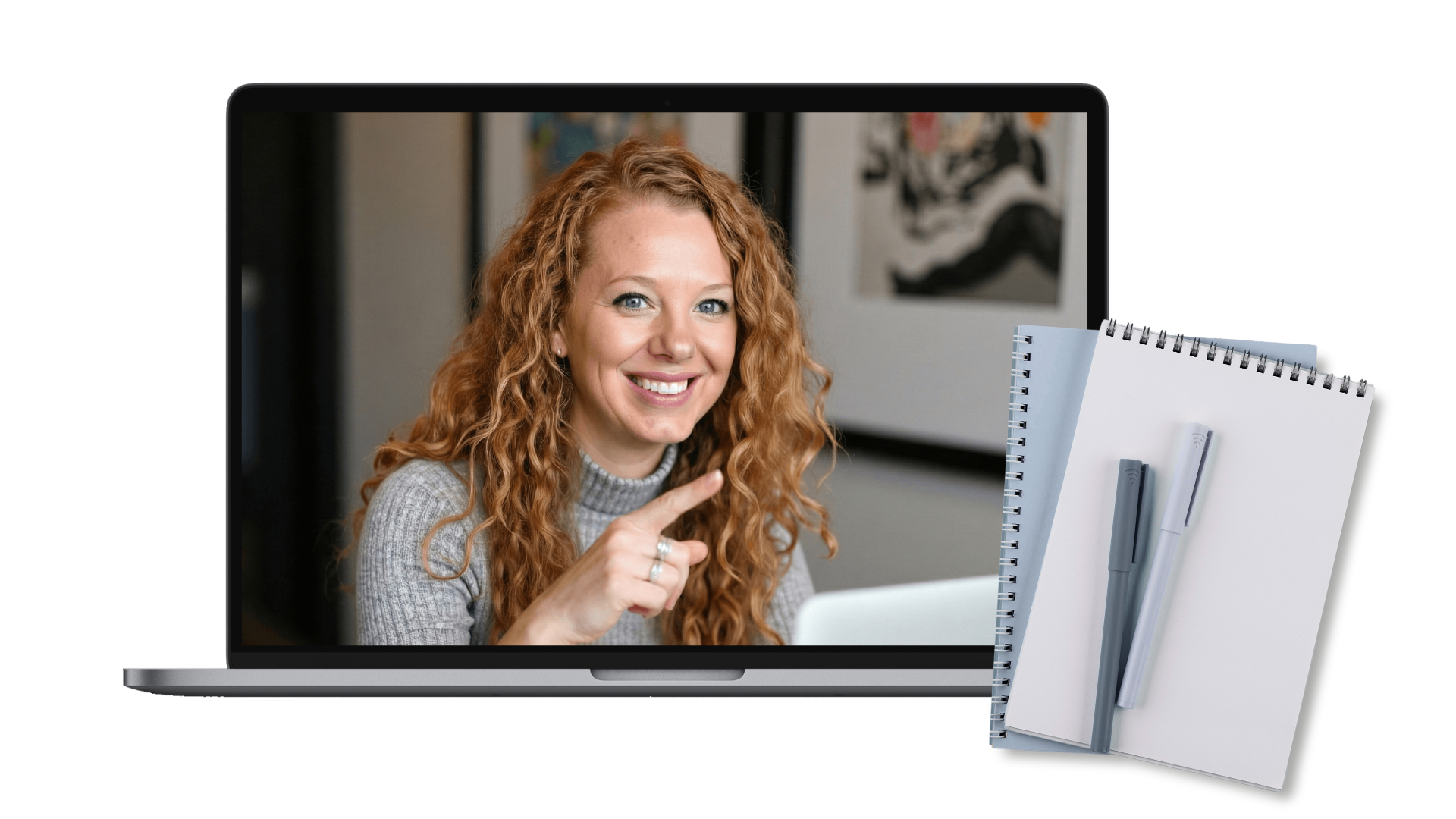 Lindsay smiling on a video call follow-up shown on a laptop next to a notebook and pens